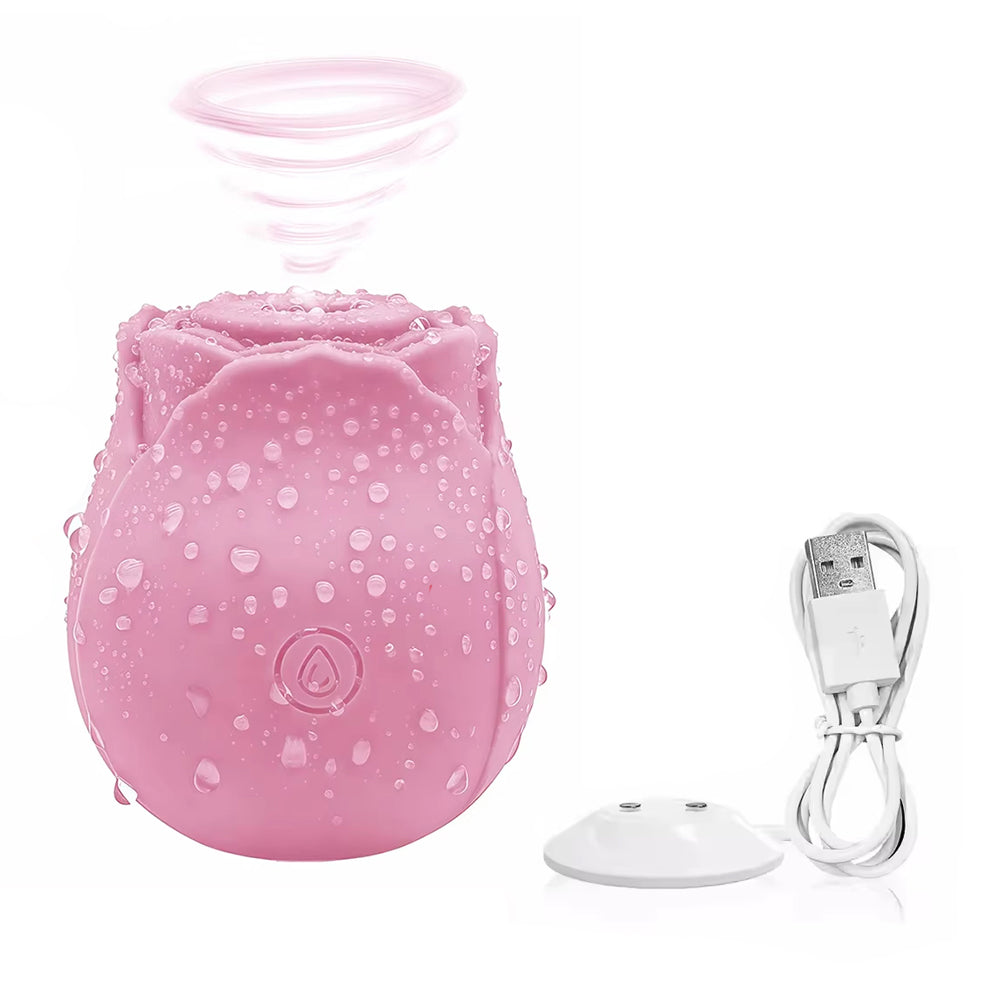 The Rose suction vibrator in blush pink with magnetic USB charging dock